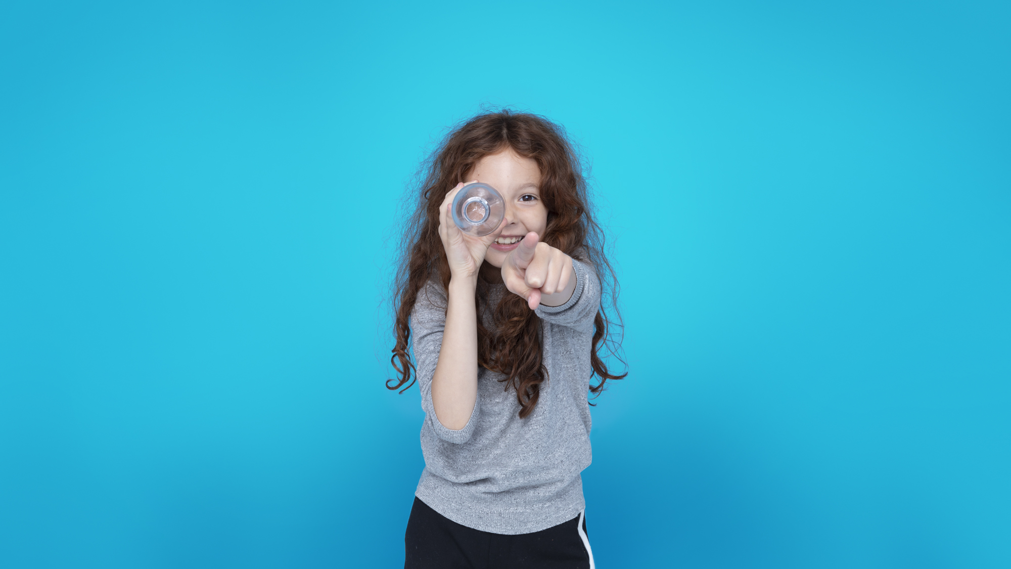 Kid pointing to camera