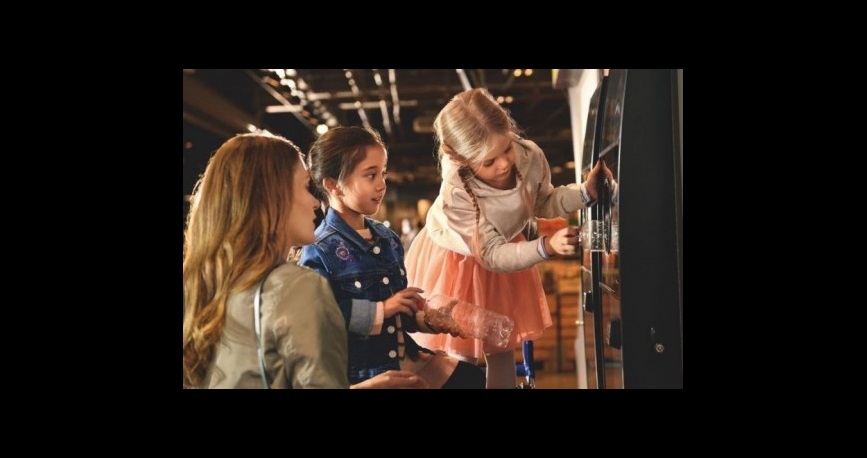 kids and mom with reverse vending machine 