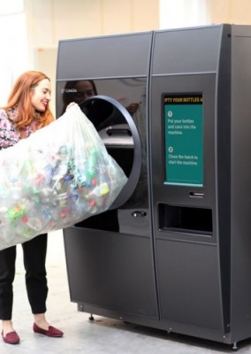 image of a woman using a reverse vending machine