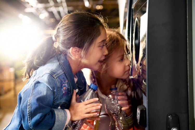 image of kids with reverse vending machine