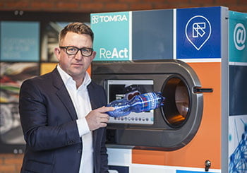 image of a man with a reverse vending machine