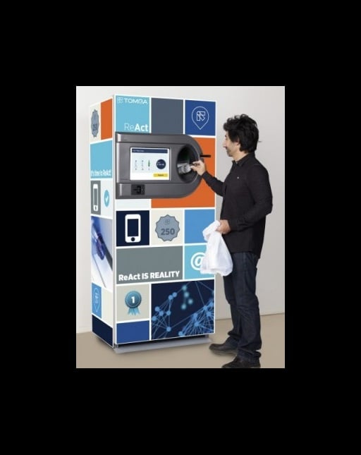 man using a reverse vending machine