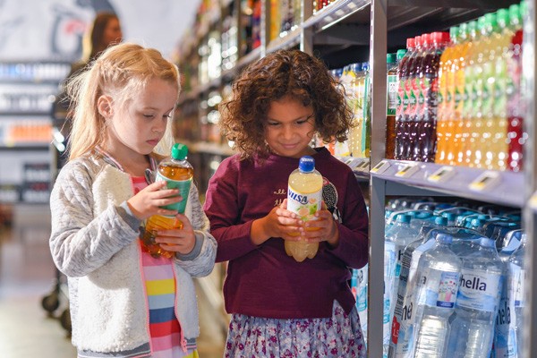 Kids looking at bottles