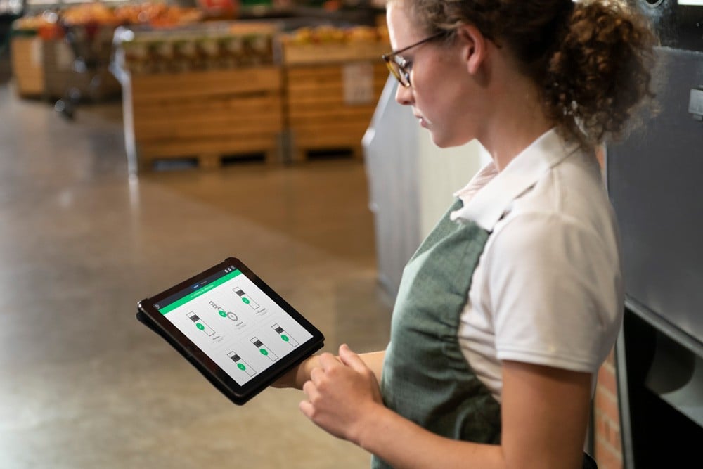 image of a store staff holding a ipad