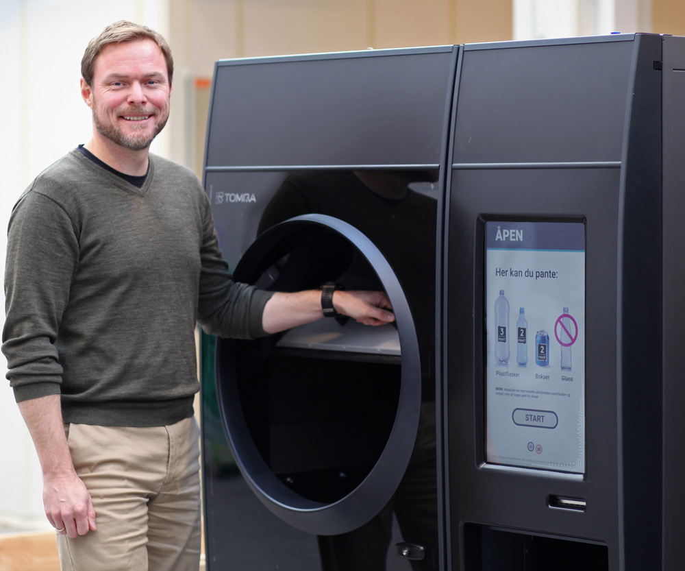 image of a man with a reverse vending machine