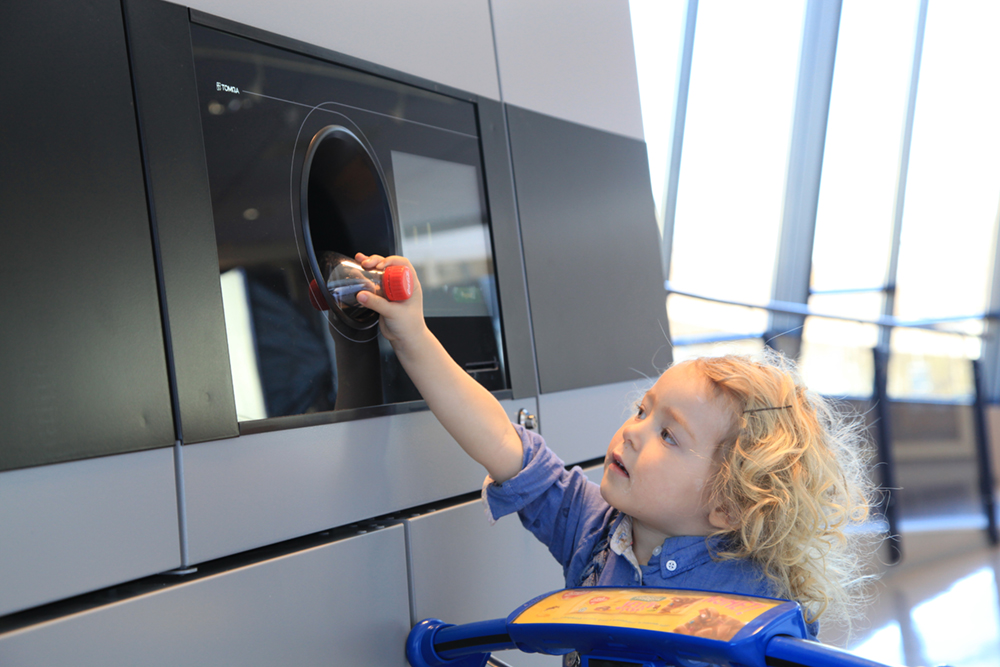 kid using TOMRA T90 reverse vending machine