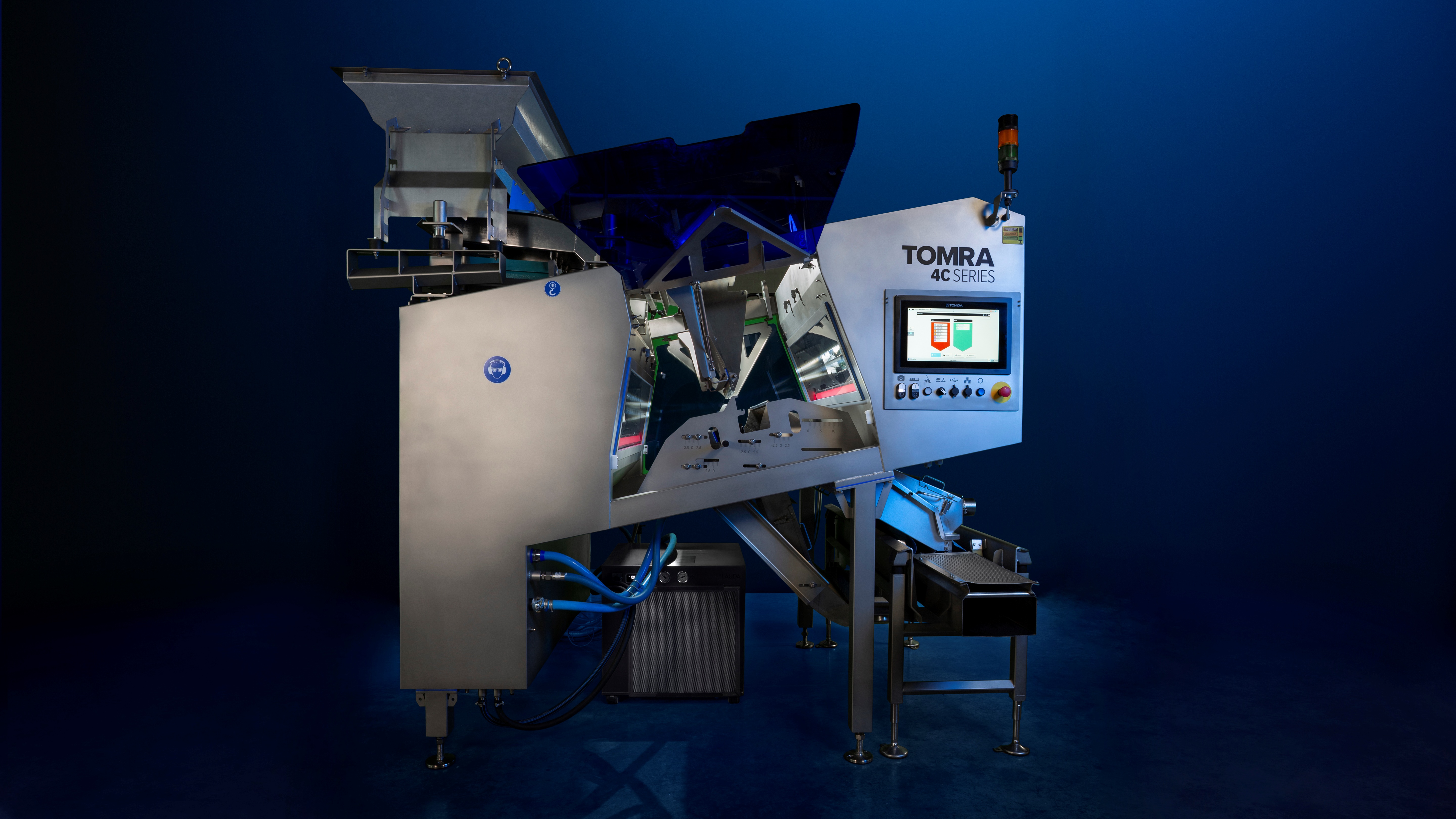 The TOMRA 4C nut sorter against a blue background