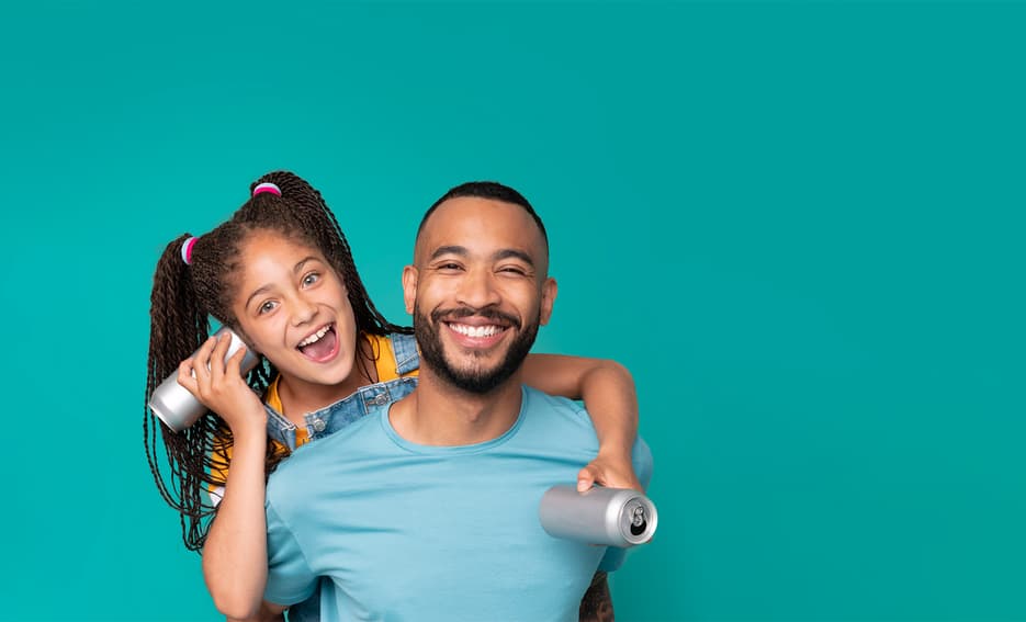 Man and girl with empty cans for recycling