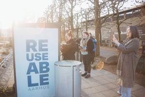 People using and taking photos of REUSEABLE collection point in Aarhus