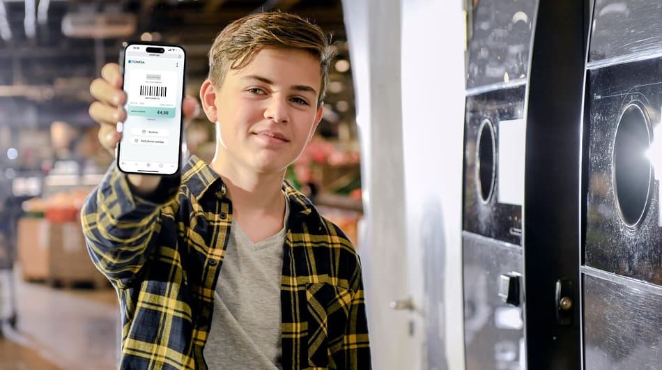 Boy showing mobile screen with RVM voucher