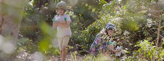 Kids picking up littered bottles