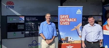 Randall Greenberg and Dugald Saunders at reverse vending kiosk