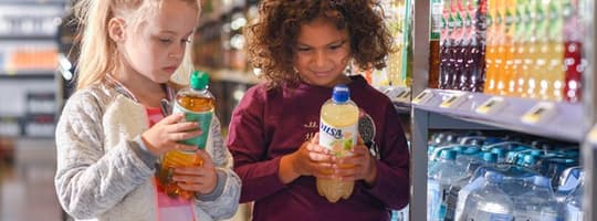 Kids looking at bottles