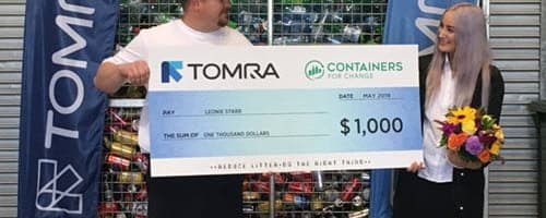couple holding cheque
