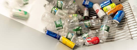 Plastic bottles sliding down a chute to be sorted