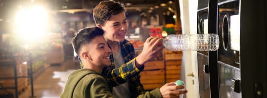 Boys at reverse vending machine