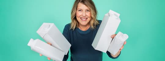 Image of woman with cartons for container materials