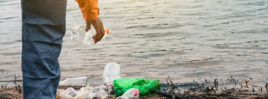Image of picking up containers on beach