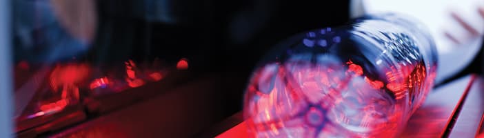 Plastic bottle inside TOMRA sensors