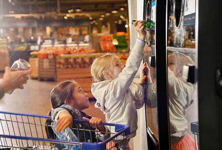 Image of consumers returning containers