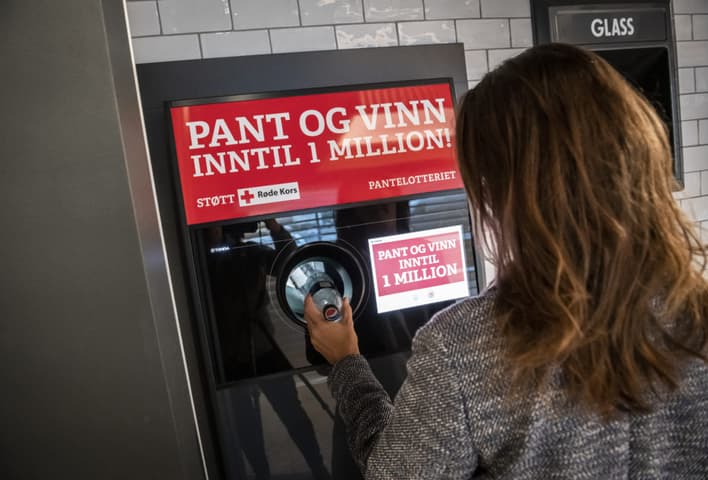 Image of consumer using Red Cross recycling lottery
