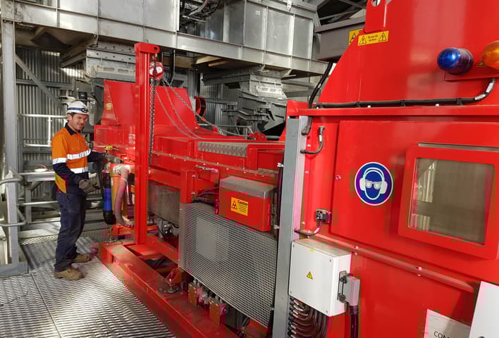 Man standing next to a TOMRA COM Tertiary sorter