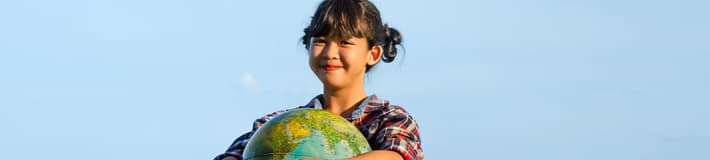 Girl holding and protecting a Globe