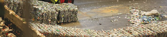 Cubed bales of compacted plastic bottles