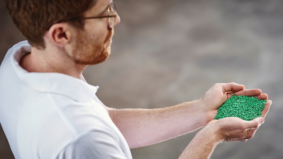 Holding green pellets