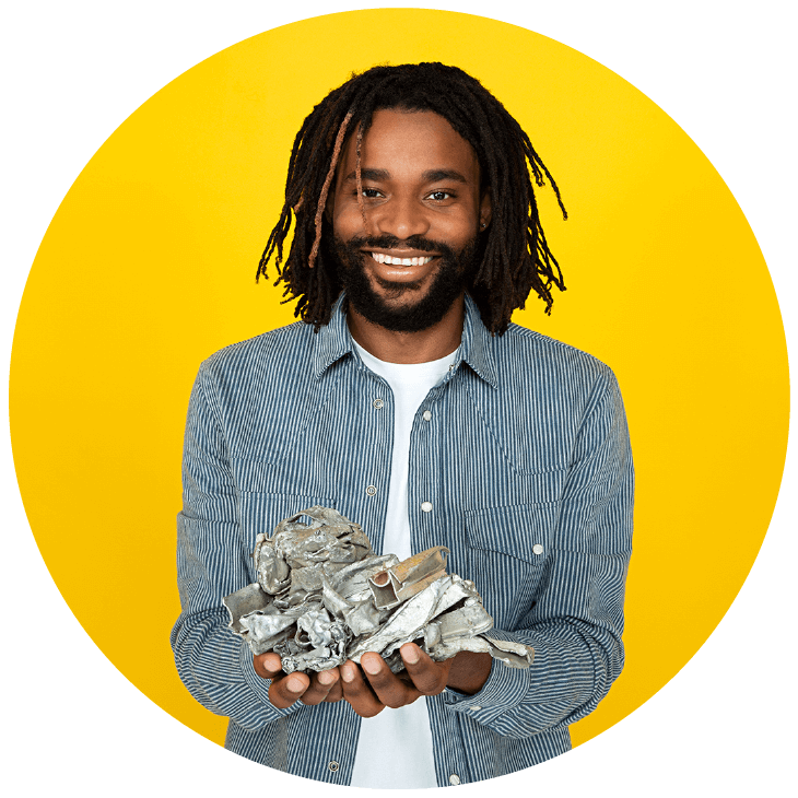 Man holding diverse recyclable materials