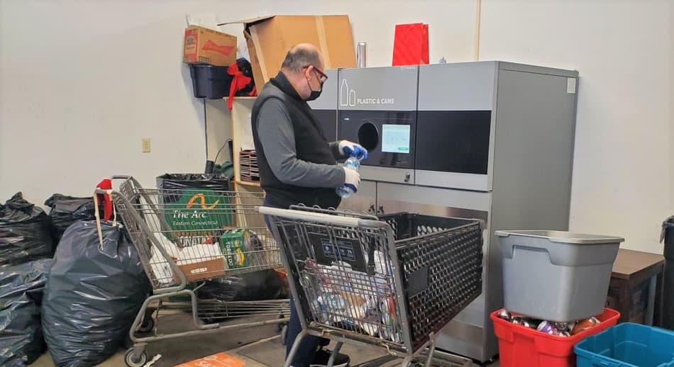 Man returning plastic bottles