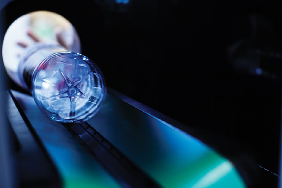 Image of hand inserting container