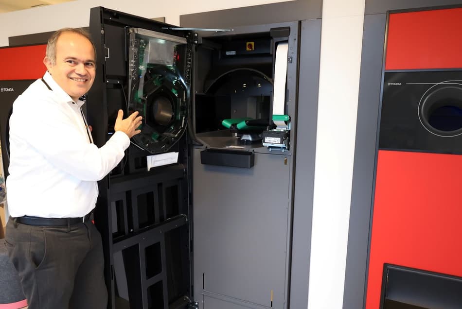 Mickael Fontaine showing inside reverse vending machines