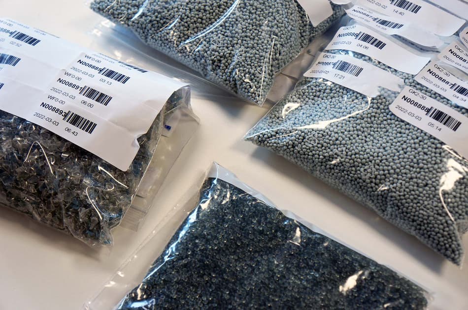 Recycled plastic pellets of various types are ready to be turned into new plastic bottles