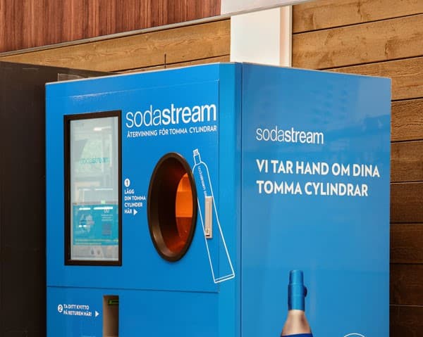 Reverse vending machine for sodastram