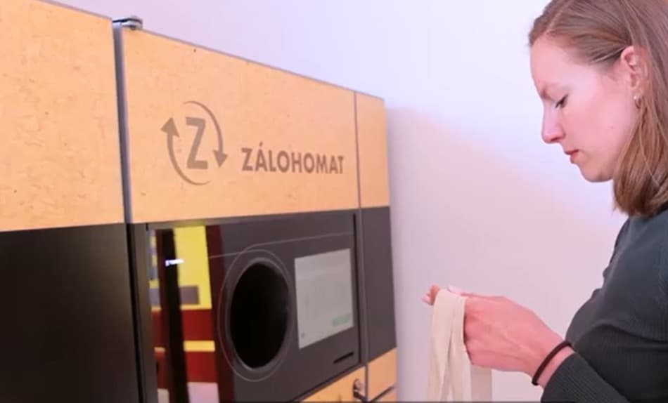 Woman returning bottles at TOMRA reverse vending machine in Slovakia