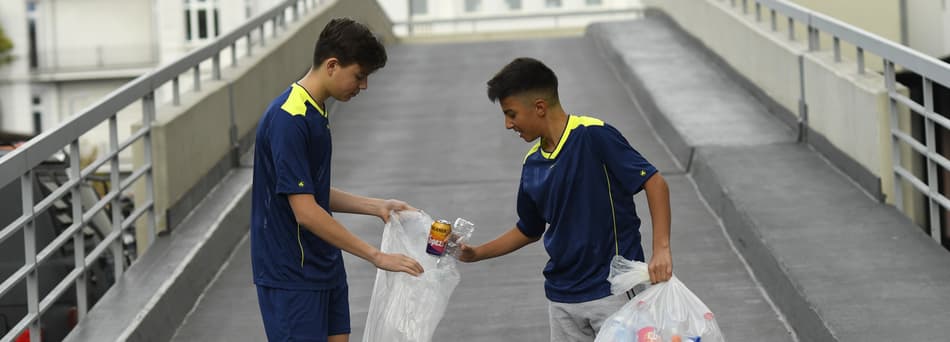 Boys collecting containers