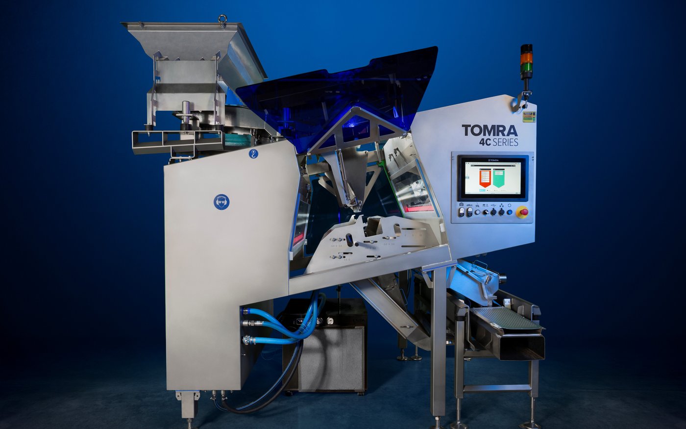 An image of the TOMRA 4C optical sorting machine on a dark background